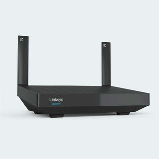 A black Linksys wireless router with two vertical antennas, shown from a three-quarters angle on a light gray background.
